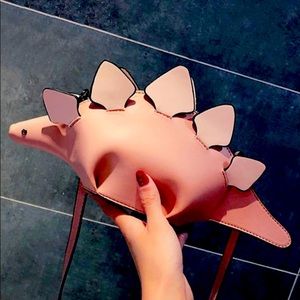 Dinosaur shaped purse.